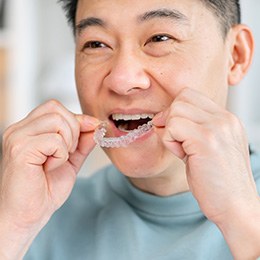 Patient in Huntington smiling with Invisalign