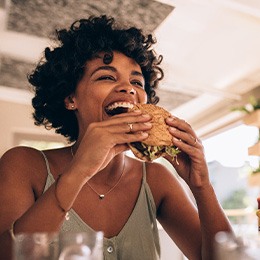 Patient in Huntington eating after taking out their Invisalign trays